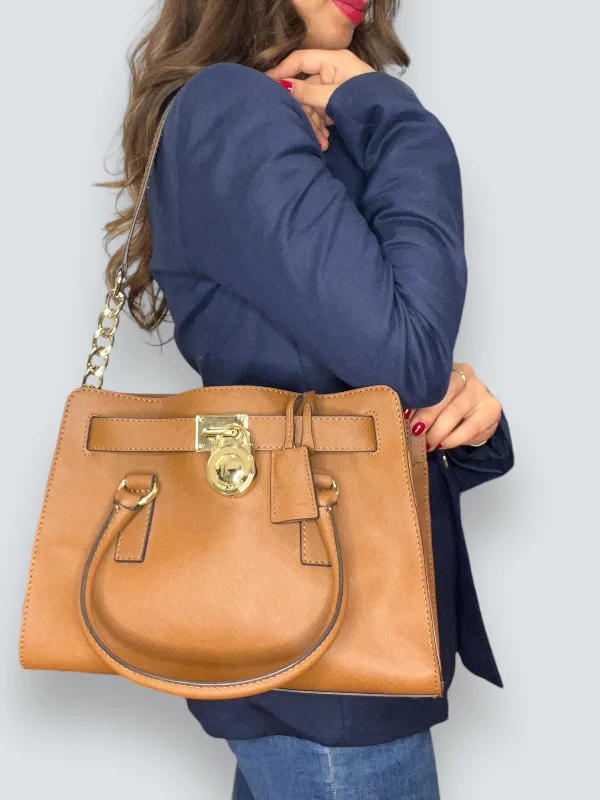 Michael Michael Kors Bags for backpackers who want a touch of luxuryMichael Kors Tan Leather Handbag